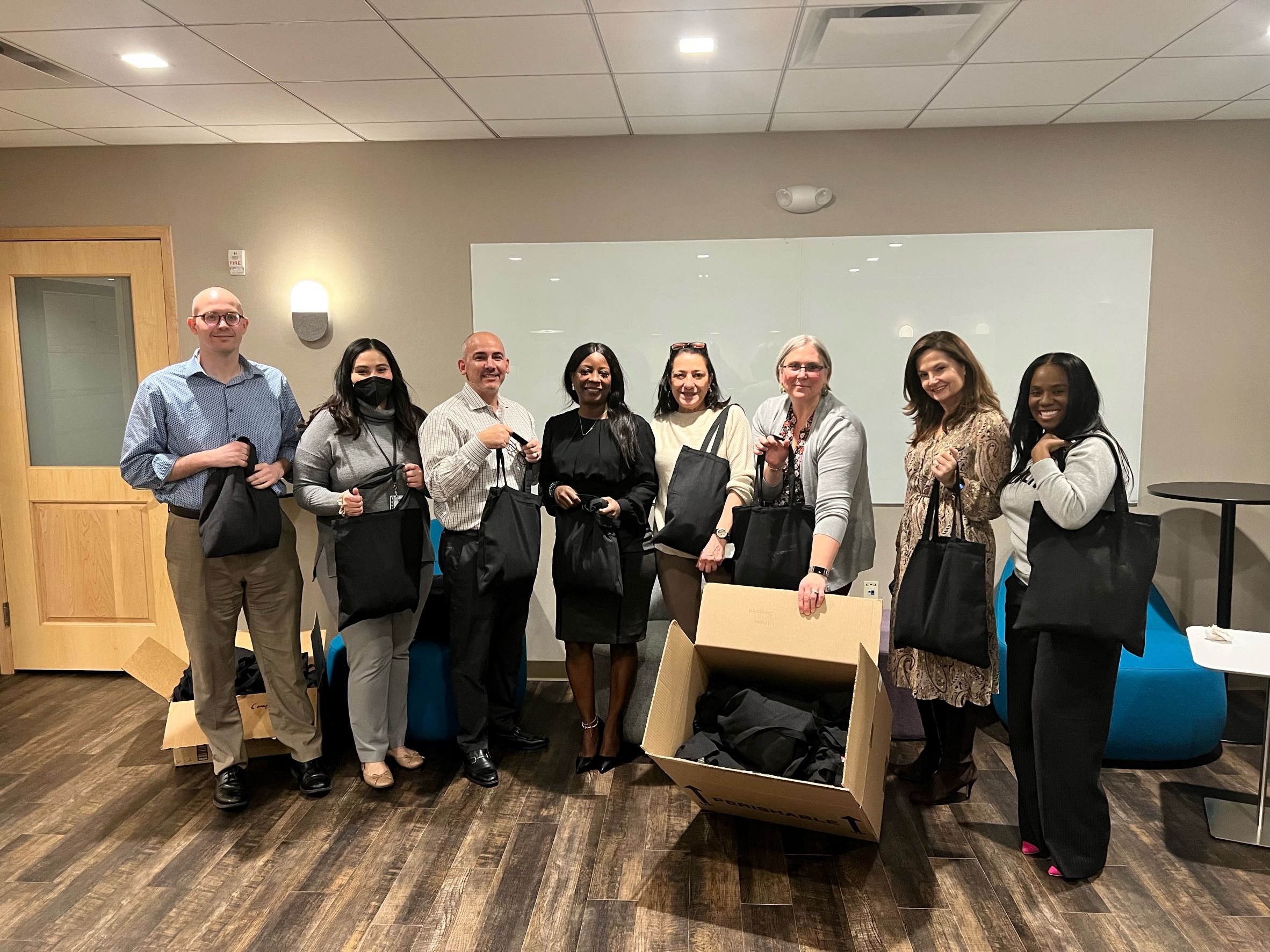 Group photo - assembling health and wellness kits for asylum seekers